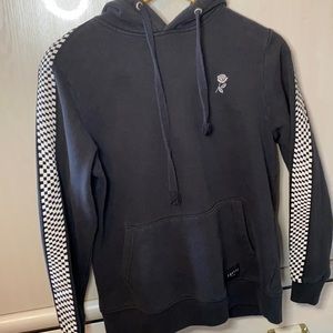Black hoodie with checker pattern on the sleeve